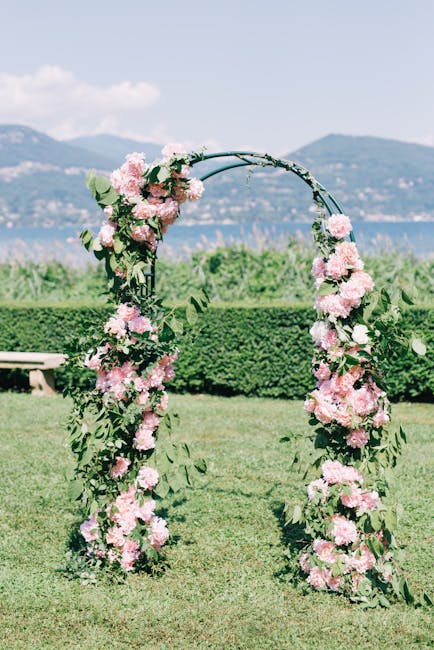 Floral wedding arch ideas with eucalyptus garland and peony cluster