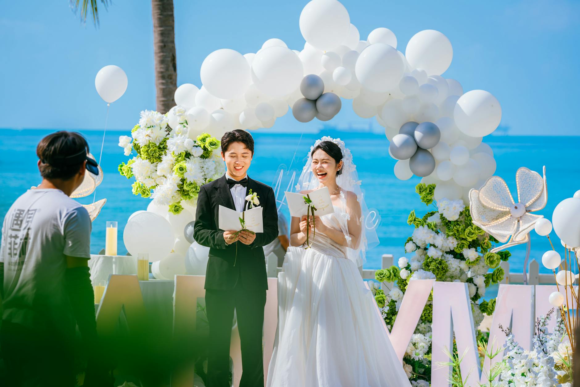 Wedding photo booth backdrop ideas with an organic blush and nude balloon garland