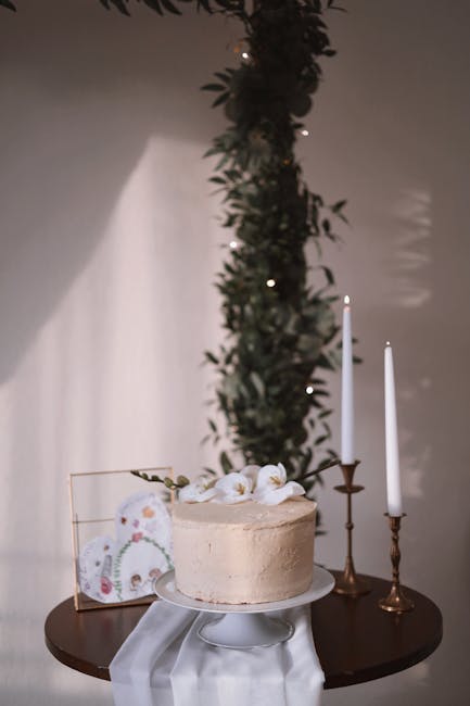 Classic white ceramic wedding cake stand holding a single-tier cake