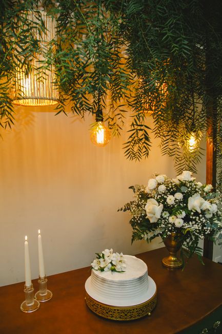 Gold metallic wedding cake stand idea on a candlelit dessert table