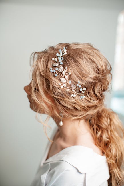 Pearl and crystal bridal hair pins scattered through a wavy bridal hairstyle