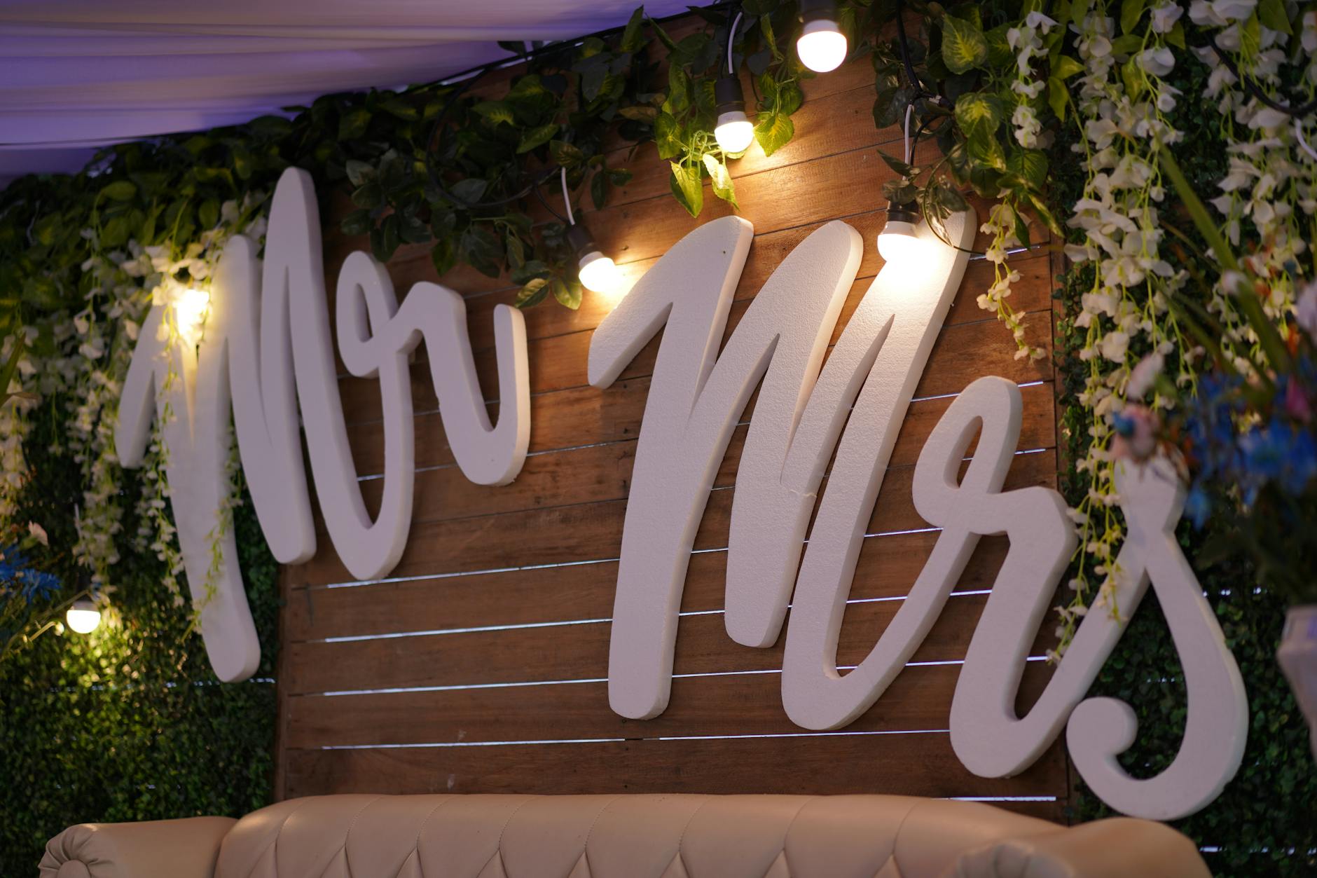 Classic Mr and Mrs wedding toasting flutes displayed on a reception table