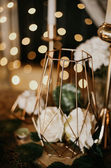 Geometric gold wedding centerpiece ideas on a modern reception table