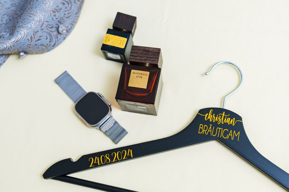 Engraved wooden wedding hanger with the couple's names and date