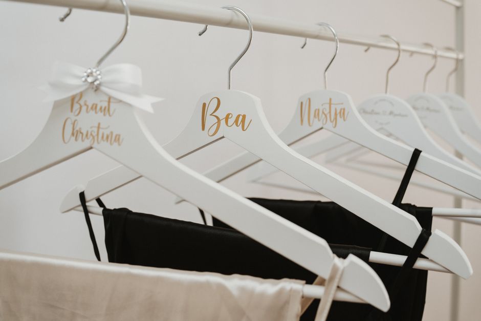 A row of matching bridal party wedding hangers personalized for each member