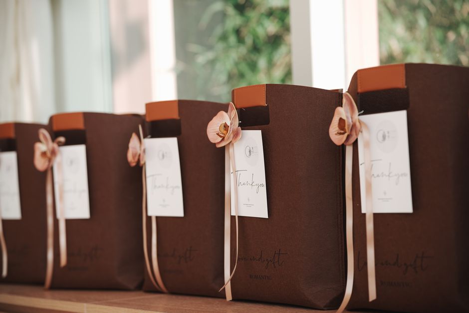 Pre-filled wedding hangover kit bags lined up and ready to hand out to guests