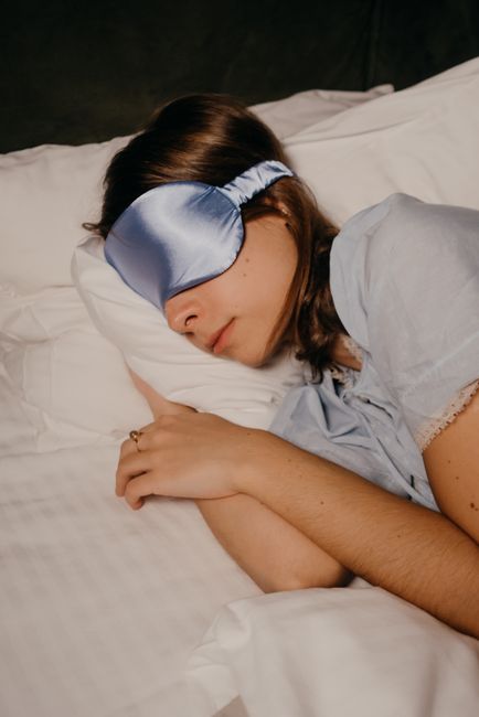 Personalized satin sleep eye mask included as a comfort item in a wedding hangover kit
