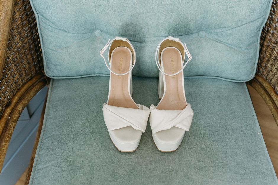 Applying a blister prevention cushion before wearing wedding shoes