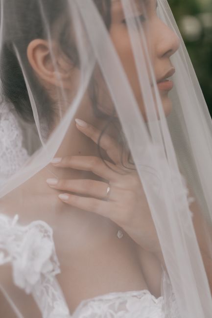 Fingertip wedding veil idea with a blusher layer worn by a bride