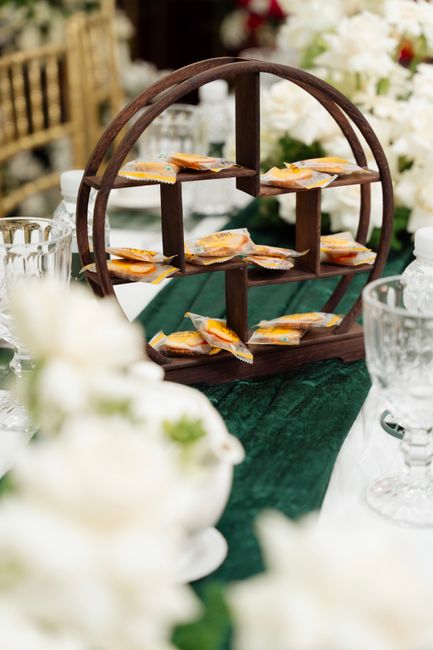 Emerald velvet wedding table runner styled with candles