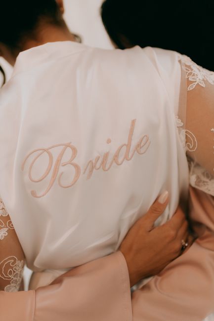 Satin bride robe with monogrammed initials embroidered on the chest