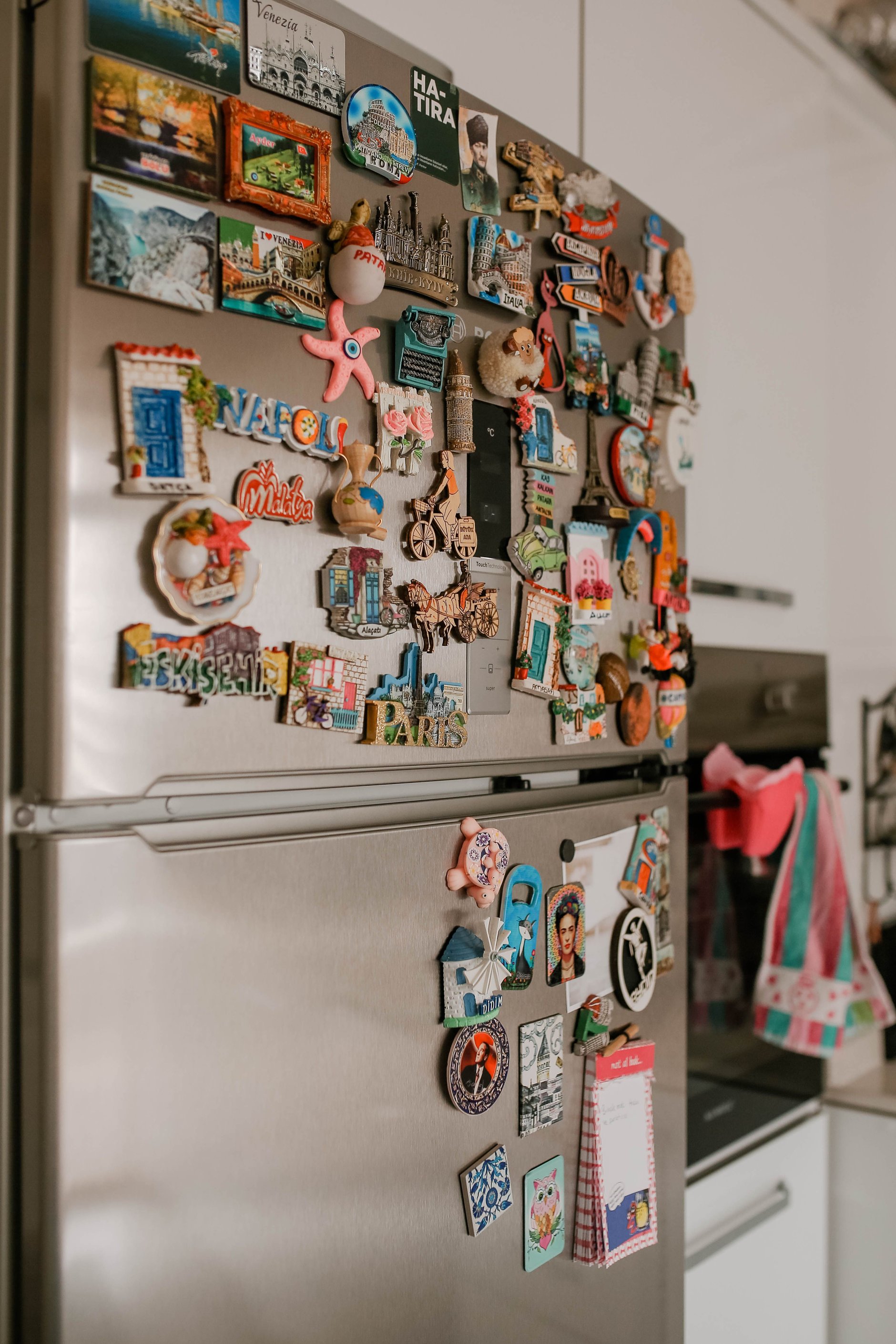 Wedding save the date photo magnet displayed on a refrigerator