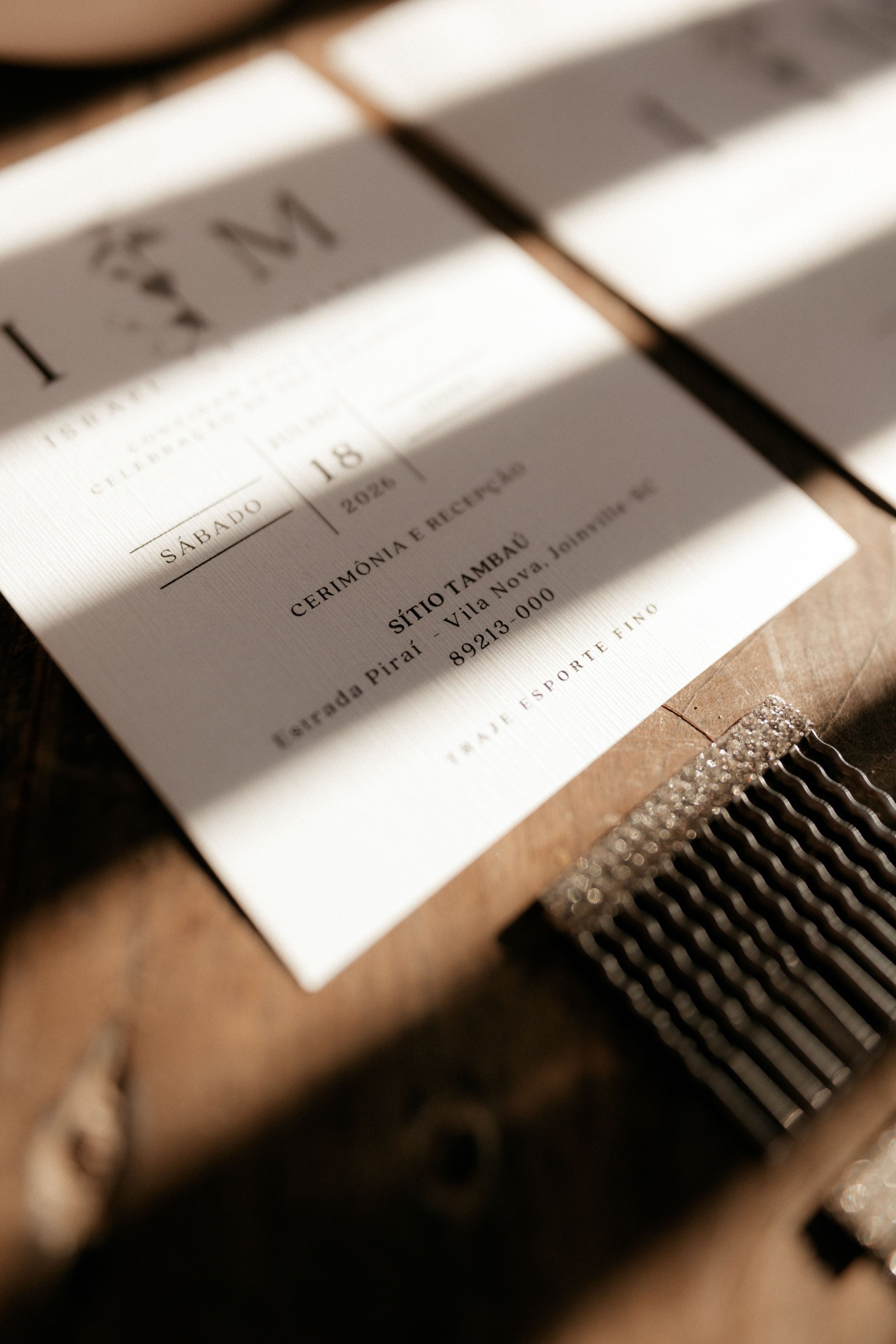Stack of wedding save the date postcards on a wooden table