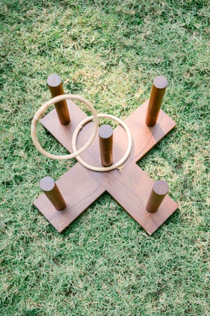 Ring toss wedding lawn game with wooden stand and rope rings