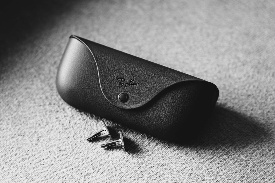 Leather cufflink storage case keeping multiple pairs organized after a wedding