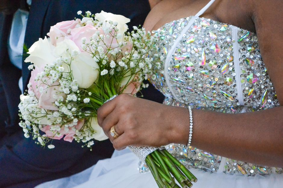 Bride wearing a crystal tennis bracelet, one of several bridal jewelry ideas for wrist detail