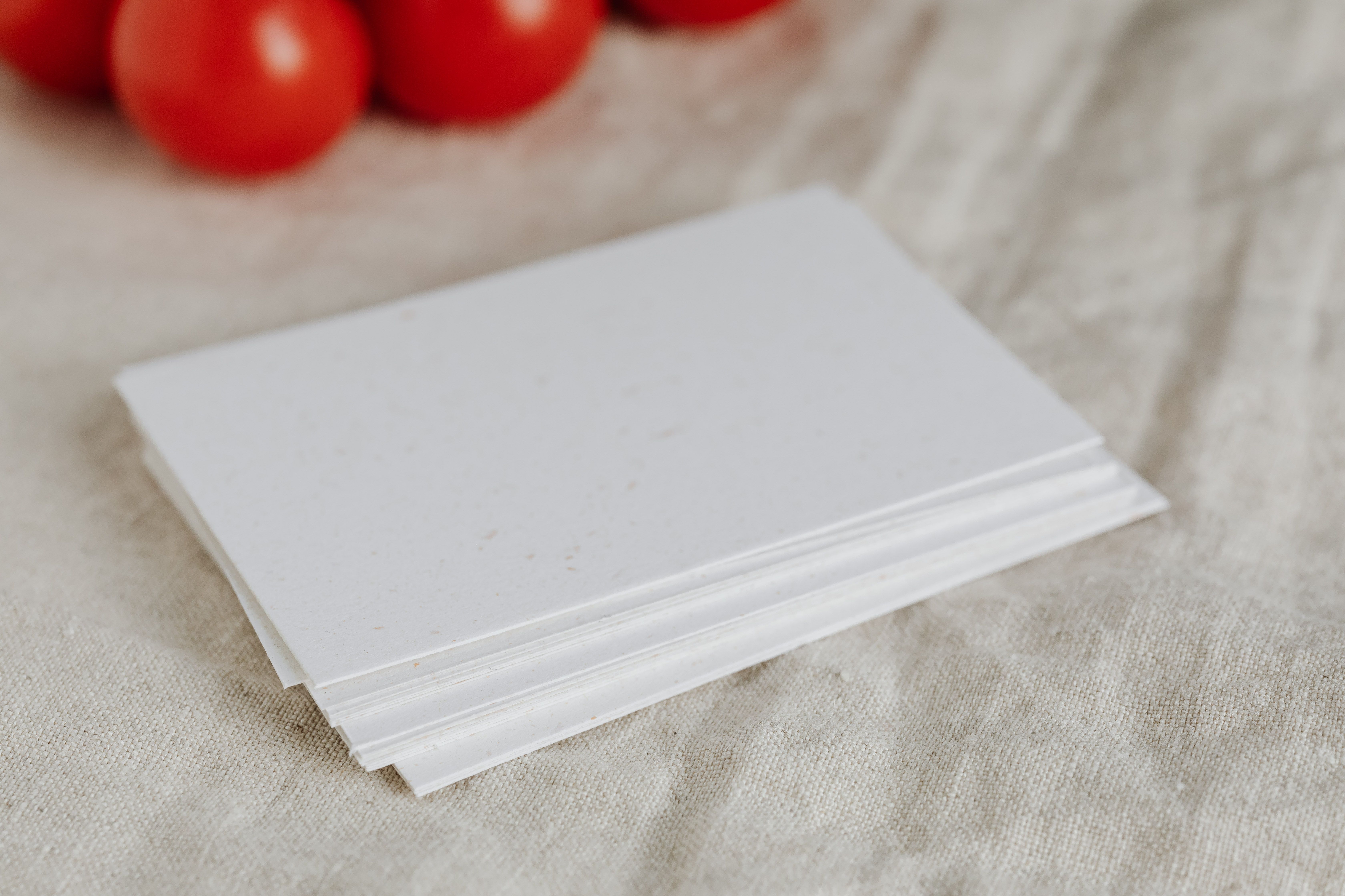 Stack of DIY printed wedding menu cards on cardstock, showing a printable wedding menu card idea