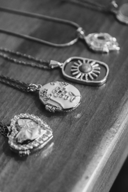 Something blue heart-shaped locket charm on a bridal bouquet