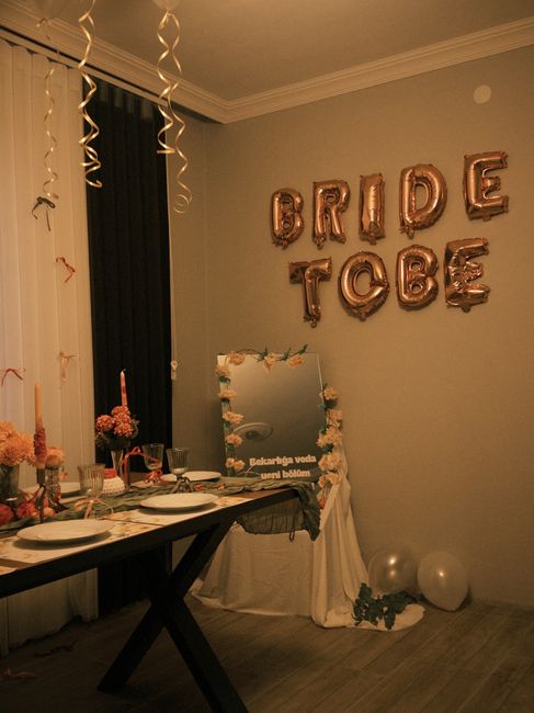 Electric balloon pump being used to inflate balloons for a wedding arch