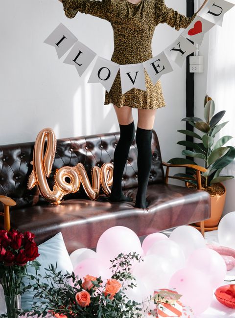 Engagement party decoration ideas banner reading He Asked She Said Yes in black and gold