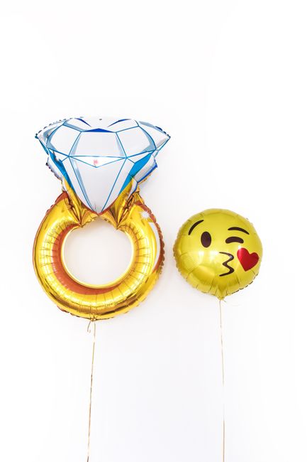 Engagement party decoration ideas showing a giant diamond ring foil balloon accent