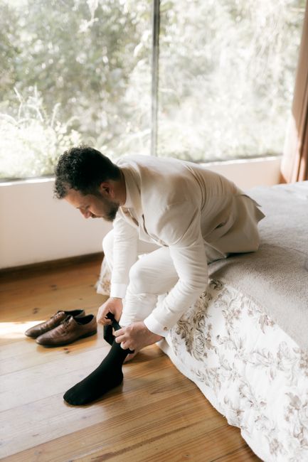 Personalized groomsmen socks labeled by role, a popular wedding proposal gift idea