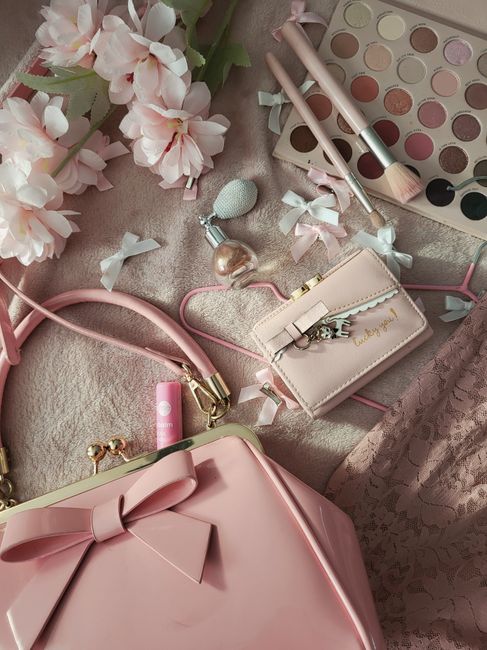 Satin bridal clutch ideas shown in coordinating pastel wedding colors