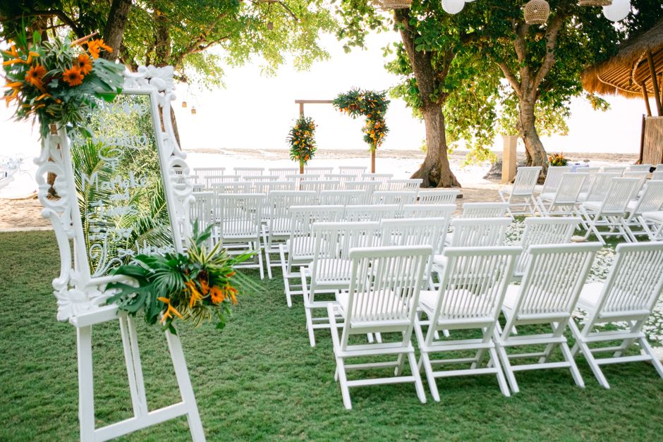 Reserved in loving memory chair sign at a wedding ceremony