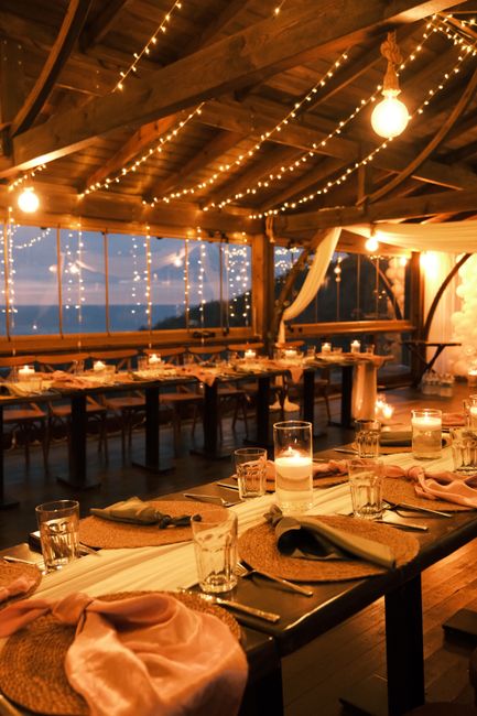 Wedding remembrance candle lantern glowing on a reception table