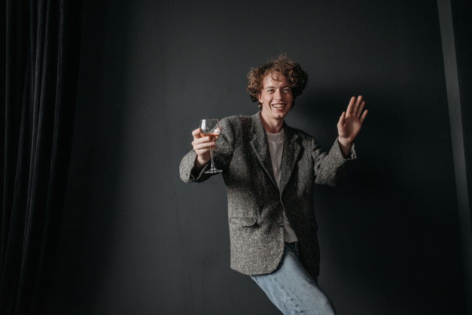 Engagement party outfit ideas for men featuring a casual blazer over a button-down shirt