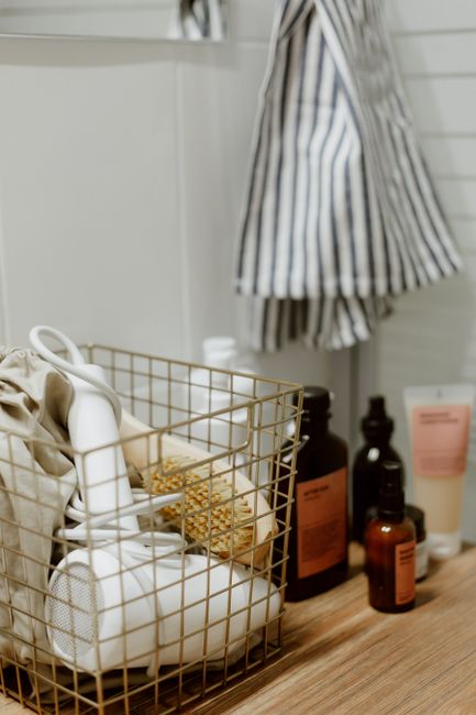 Felt wedding bathroom basket set on a restroom counter