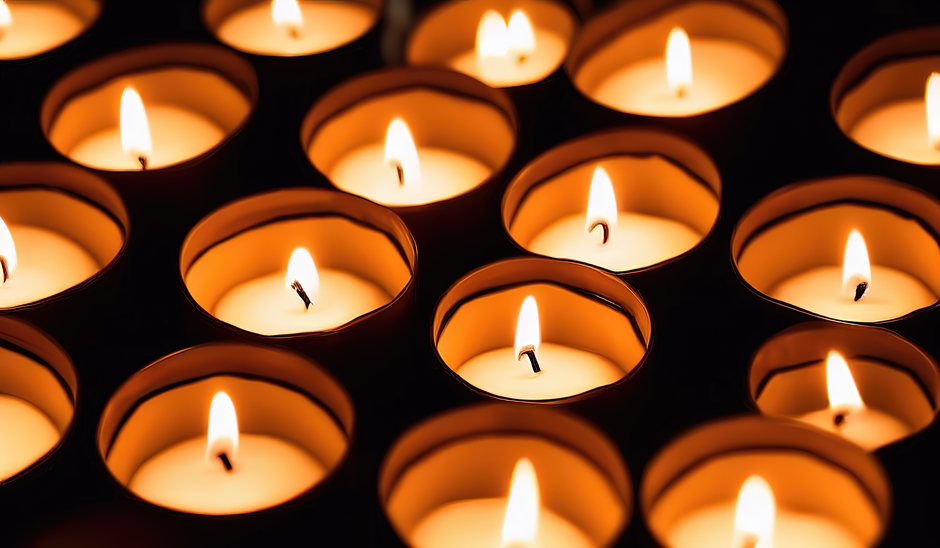 Votive wedding candle holders scattered down a reception table