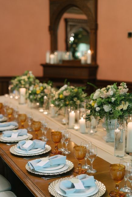Mirrored acrylic wedding bar sign catching candlelight