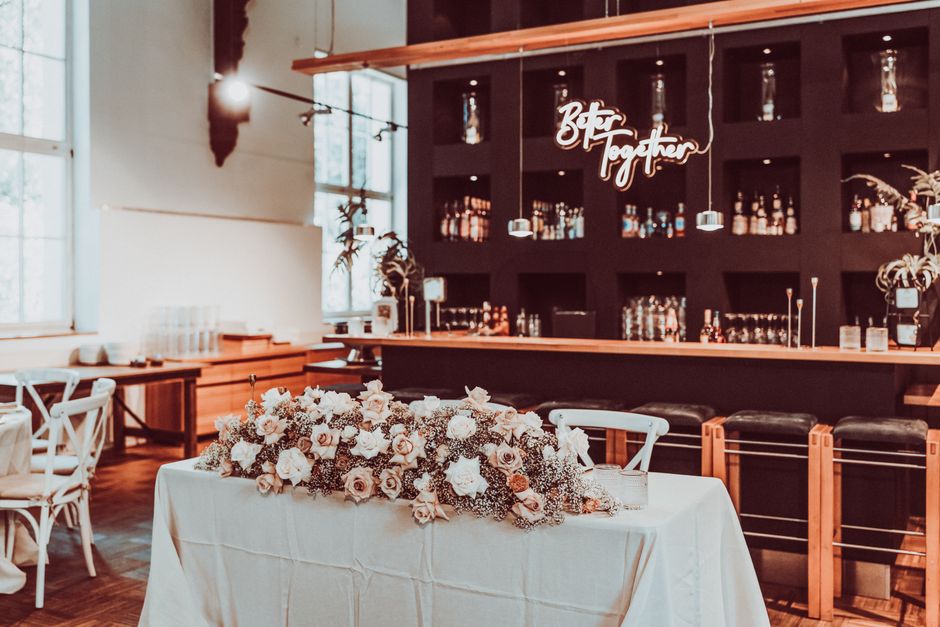 Small custom bar sign on a wedding reception bar