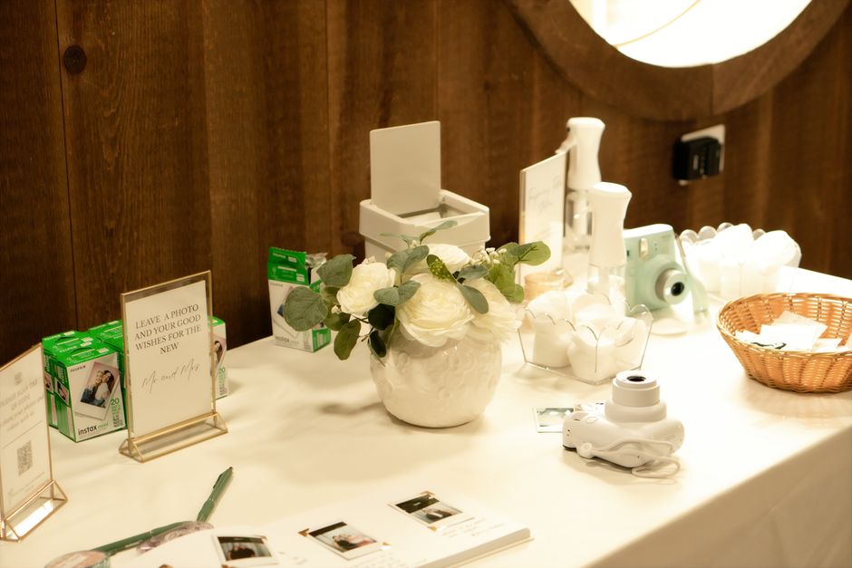 Instant camera guest book station at a wedding