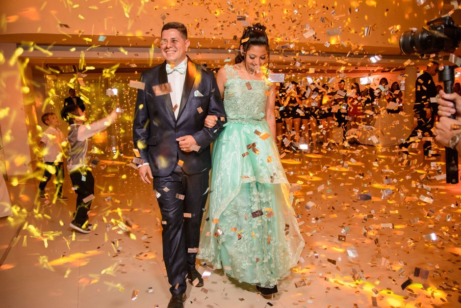 electric confetti launcher firing over a wedding reception dance floor