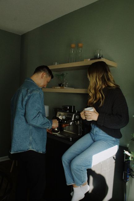 couple sharing coffee from matching couple coffee mugs